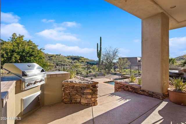 view of terrace featuring area for grilling