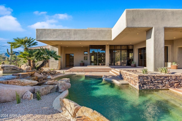 view of pool featuring a patio