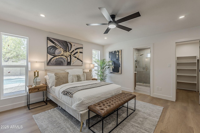 5028 W Shangri La Rd, Glendale, AZ 85304 - bedroom featuring light wood finished floors, a walk in closet, recessed lighting, connected bathroom, and a ceiling fan