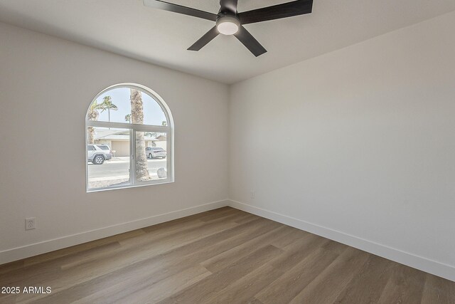 5028 W Shangri La Rd, Glendale, AZ 85304 - empty room with a ceiling fan and wood finished floors