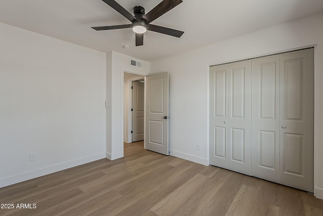 5028 W Shangri La Rd, Glendale, AZ 85304 - unfurnished bedroom featuring light wood-style flooring, a closet, and a ceiling fan