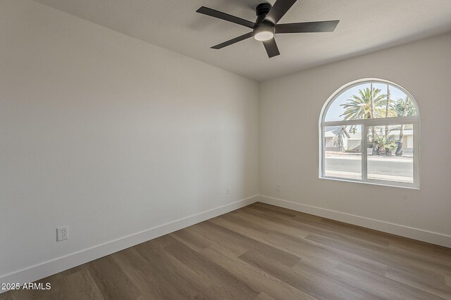 5028 W Shangri La Rd, Glendale, AZ 85304 - empty room featuring wood finished floors and a ceiling fan