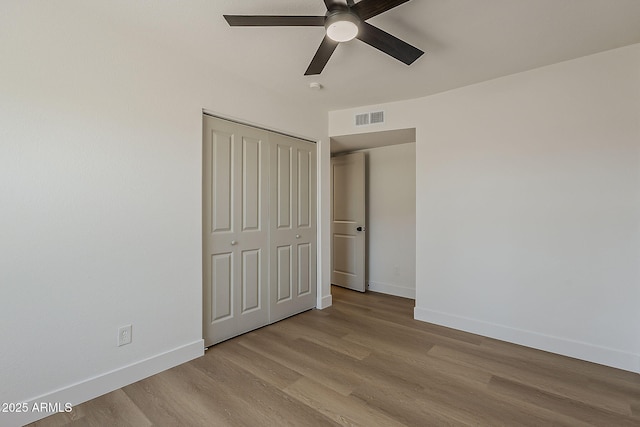 5028 W Shangri La Rd, Glendale, AZ 85304 - unfurnished bedroom with light wood-type flooring, a closet, and ceiling fan