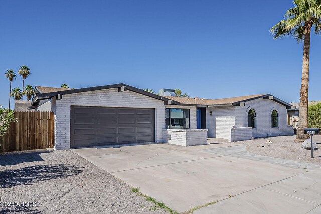 5028 W Shangri La Rd, Glendale, AZ 85304 - ranch-style home with a garage, driveway, and brick siding