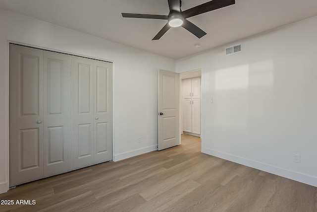 5028 W Shangri La Rd, Glendale, AZ 85304 - unfurnished bedroom featuring light wood-style floors, a closet, and a ceiling fan