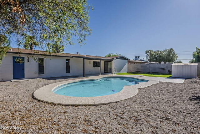 5028 W Shangri La Rd, Glendale, AZ 85304 - view of swimming pool with a shed, a fenced backyard, and a patio area