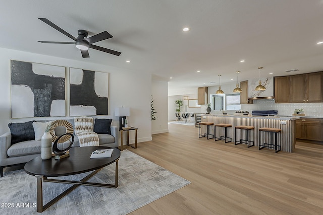 5028 W Shangri La Rd, Glendale, AZ 85304 - living room featuring light wood-style floors, ceiling fan, recessed lighting, and wine cooler