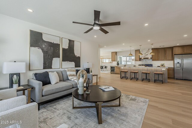 5028 W Shangri La Rd, Glendale, AZ 85304 - living area with beverage cooler, ceiling fan, light wood-type flooring, and recessed lighting