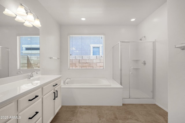 full bathroom with a bath, a wealth of natural light, a shower stall, and vanity