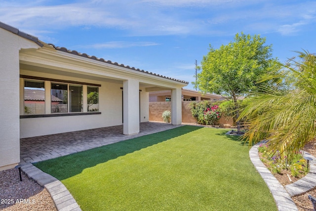view of yard with a patio area and fence