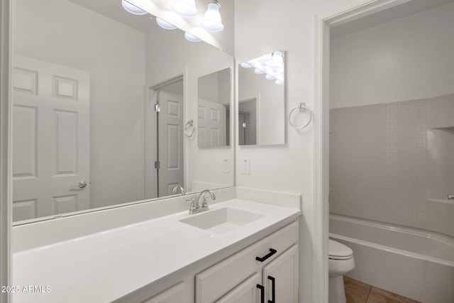 full bath with toilet, vanity, and tile patterned flooring
