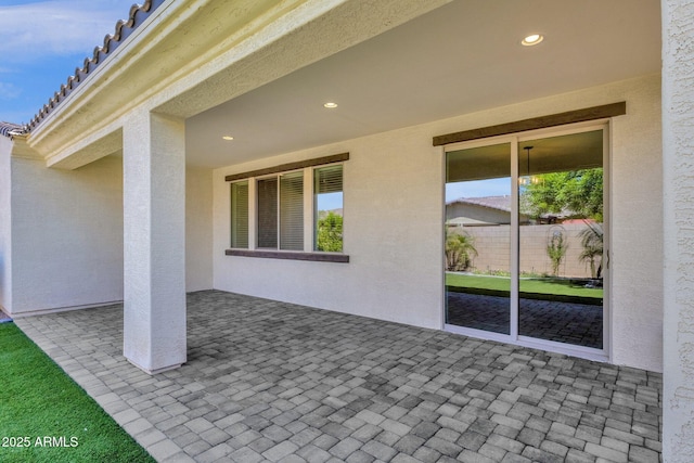 view of patio / terrace featuring fence
