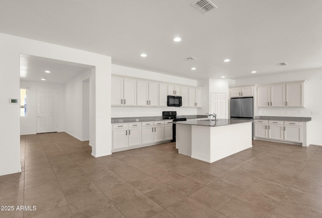 kitchen featuring visible vents, white cabinets, recessed lighting, and stainless steel appliances