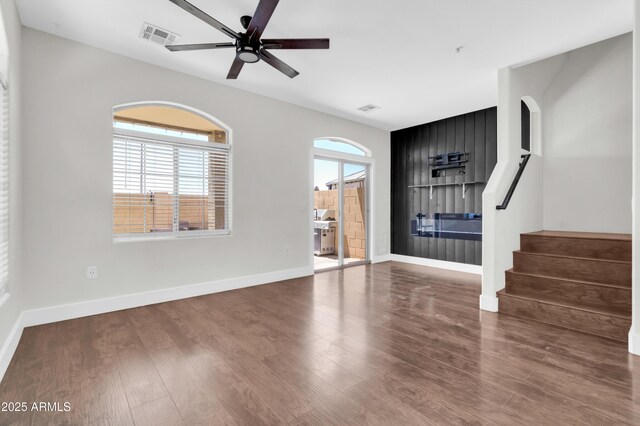 1350 S Greenfield Rd Unit 1166, Mesa, AZ 85206 - empty room featuring wood finished floors, a ceiling fan, stairs, and baseboards
