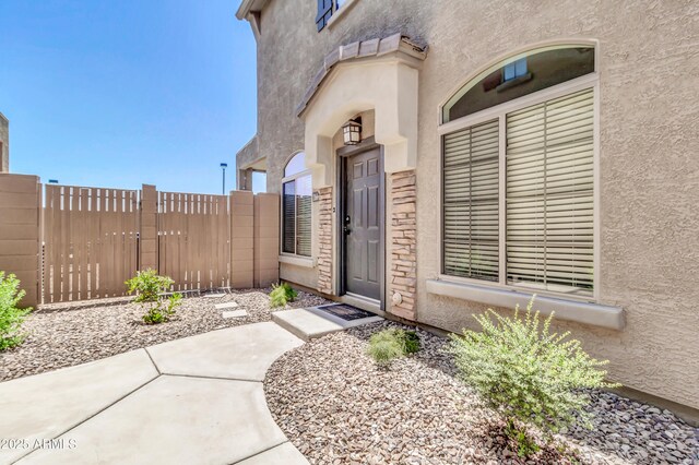 1350 S Greenfield Rd Unit 1166, Mesa, AZ 85206 - property entrance with a gate, stucco siding, and fence