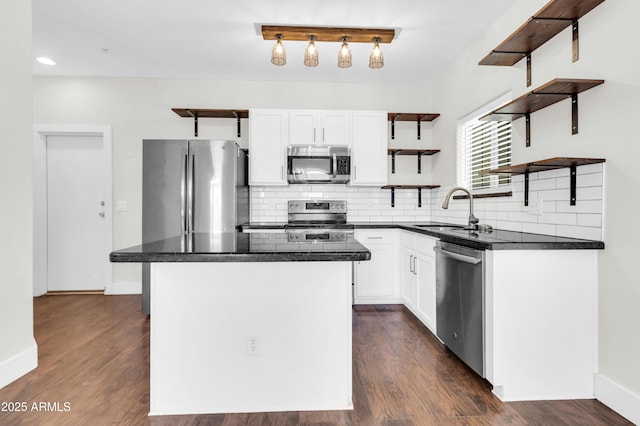 1350 S Greenfield Rd Unit 1166, Mesa, AZ 85206 - kitchen featuring open shelves, stainless steel appliances, a sink, dark countertops, and tasteful backsplash