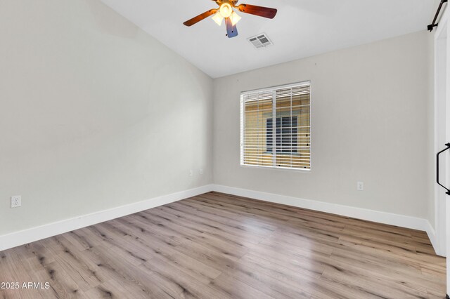 1350 S Greenfield Rd Unit 1166, Mesa, AZ 85206 - unfurnished room with vaulted ceiling, ceiling fan, wood finished floors, and baseboards