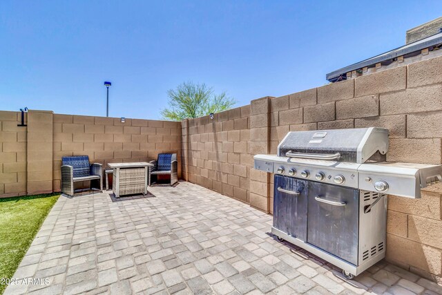 1350 S Greenfield Rd Unit 1166, Mesa, AZ 85206 - view of patio / terrace with grilling area and fence