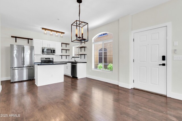 1350 S Greenfield Rd Unit 1166, Mesa, AZ 85206 - kitchen featuring appliances with stainless steel finishes, open shelves, white cabinetry, backsplash, and a sink