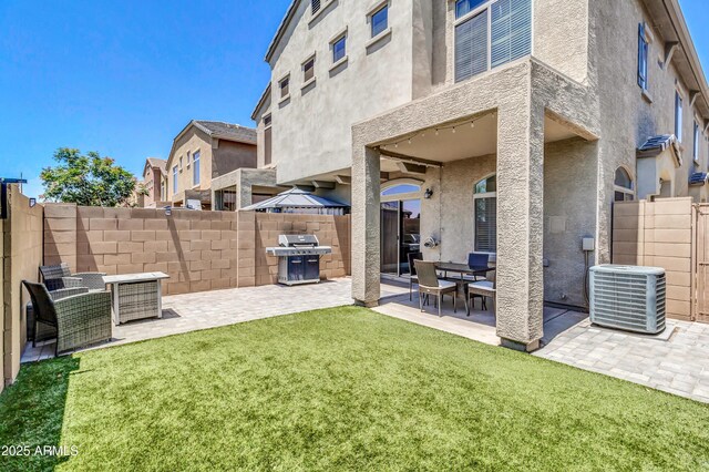 1350 S Greenfield Rd Unit 1166, Mesa, AZ 85206 - back of house featuring a patio area, central AC unit, and stucco siding