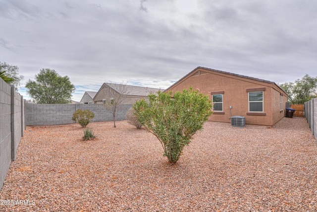 view of side of property with central AC unit