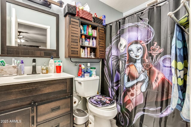 bathroom with vanity, toilet, and ceiling fan