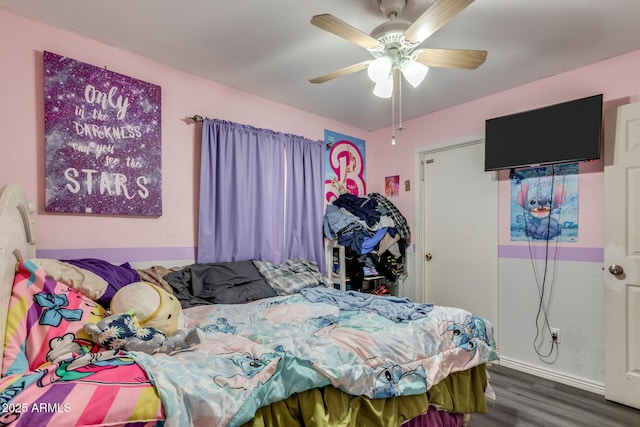 bedroom featuring ceiling fan and dark hardwood / wood-style flooring