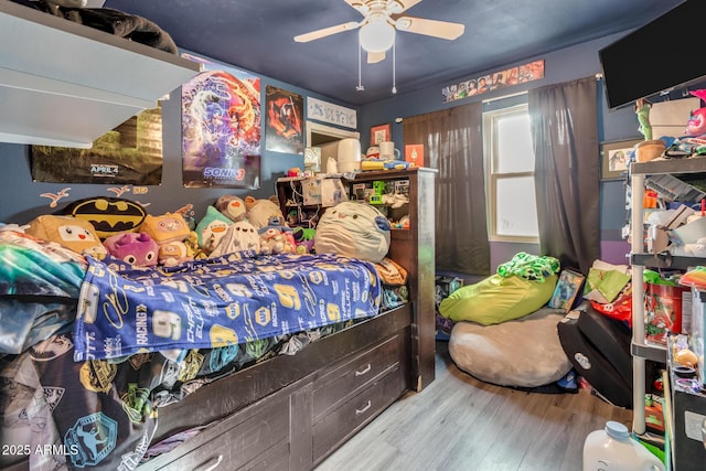 bedroom with ceiling fan and light wood-type flooring