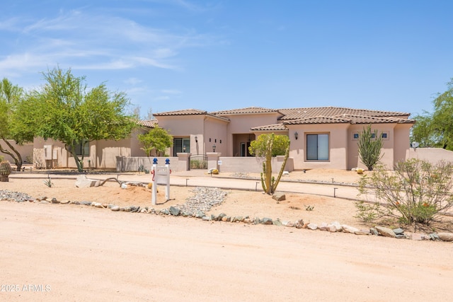 16246 E Gamble Ln, Scottsdale, AZ 85262 - mediterranean / spanish-style home with a fenced front yard, stucco siding, and a tile roof