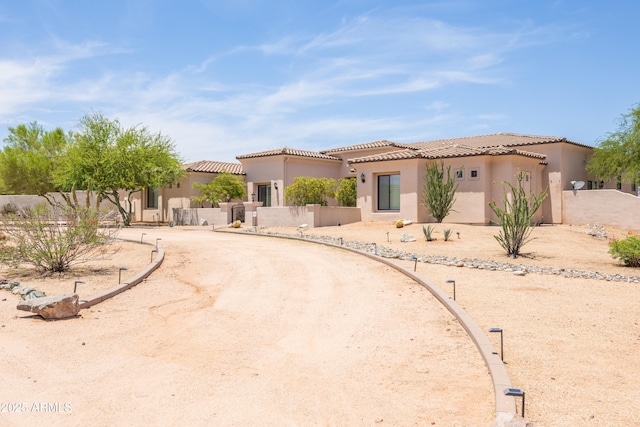 16246 E Gamble Ln, Scottsdale, AZ 85262 - mediterranean / spanish-style home featuring stucco siding, a gate, and a tile roof