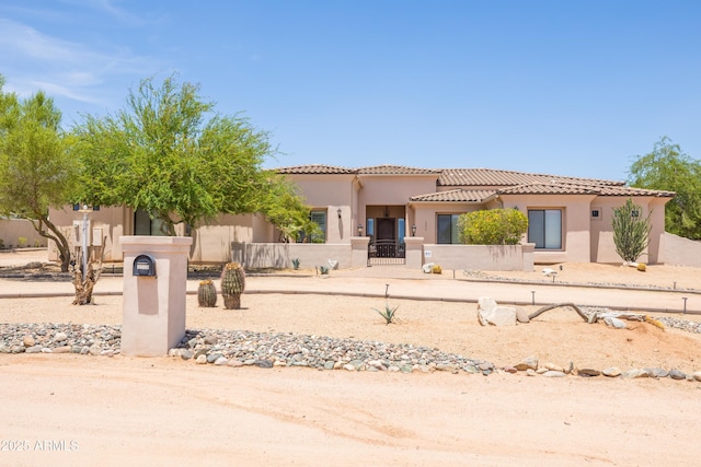 16246 E Gamble Ln, Scottsdale, AZ 85262 - view of front of property with a fenced front yard, stucco siding, a gate, and a tile roof
