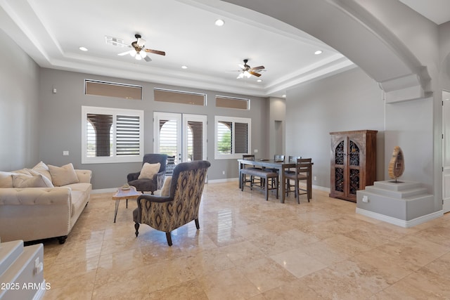 16246 E Gamble Ln, Scottsdale, AZ 85262 - living room with a raised ceiling, ceiling fan, recessed lighting, and arched walkways