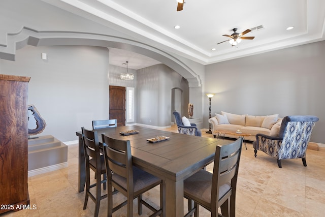 16246 E Gamble Ln, Scottsdale, AZ 85262 - dining room featuring arched walkways, a ceiling fan, recessed lighting, and a raised ceiling