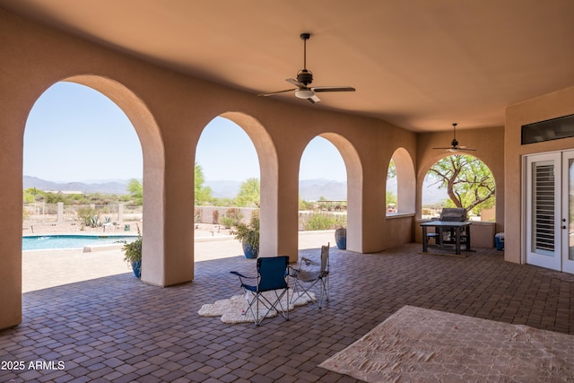 16246 E Gamble Ln, Scottsdale, AZ 85262 - fenced backyard with a mountain view, ceiling fan, a patio, and french doors