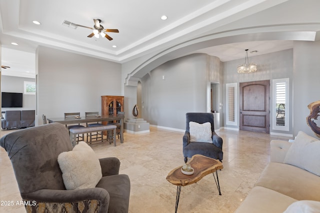 16246 E Gamble Ln, Scottsdale, AZ 85262 - living area featuring arched walkways, plenty of natural light, recessed lighting, a ceiling fan, and a chandelier