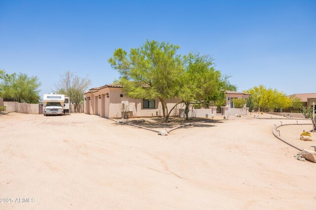 16246 E Gamble Ln, Scottsdale, AZ 85262 - view of front facade featuring stucco siding, a garage, and driveway
