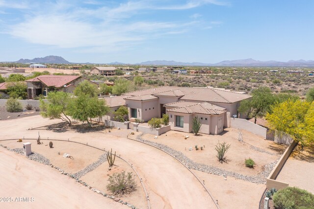 16246 E Gamble Ln, Scottsdale, AZ 85262 - view of front facade featuring a tiled roof, stucco siding, driveway, a mountain view, and a garage