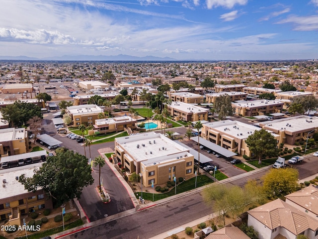 drone / aerial view featuring a residential view and a mountain view