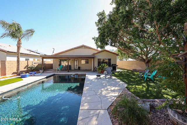 view of swimming pool with a grill, a yard, and a patio area