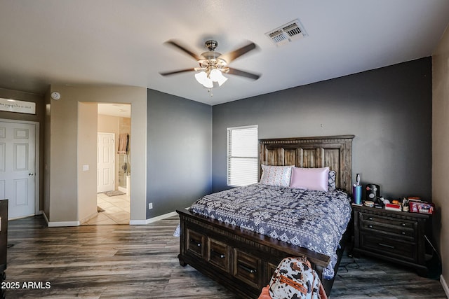 6640 W Honeysuckle Dr, Phoenix, AZ 85083 - bedroom featuring dark hardwood / wood-style flooring, ceiling fan, and ensuite bathroom
