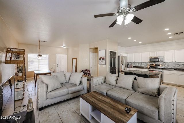 6640 W Honeysuckle Dr, Phoenix, AZ 85083 - tiled living room featuring ceiling fan