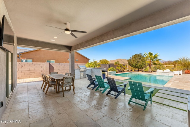 view of patio / terrace featuring an outdoor kitchen, a grill, outdoor dining area, and a fenced backyard