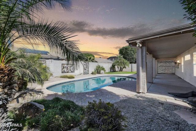 view of pool with a fenced in pool, a fenced backyard, and a patio