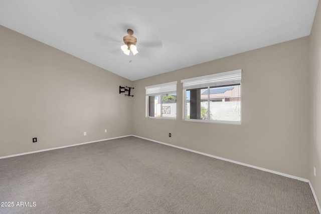 empty room with carpet floors, ceiling fan, and baseboards