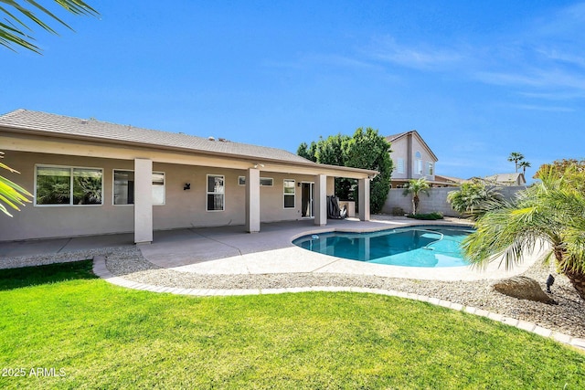 view of swimming pool featuring a fenced in pool, a patio area, fence, and a lawn