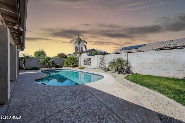 view of swimming pool with a fenced backyard, a fenced in pool, and a patio