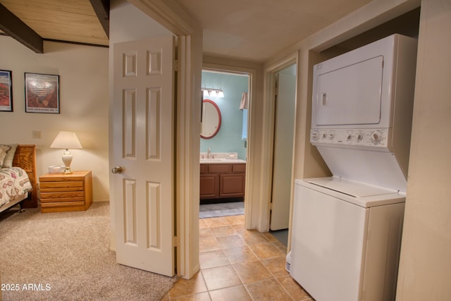 4575 Resort Loop Unit 6, Pinetop, AZ 85935 - clothes washing area with estacked washer and dryer and light tile patterned floors