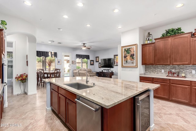 800 W Sycamore Ct, Litchfield Park, AZ 85340 - kitchen with beverage cooler, an island with sink, recessed lighting, ceiling fan, and a sink