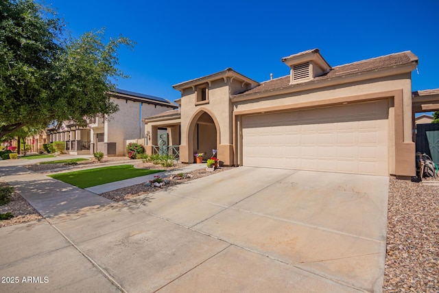 800 W Sycamore Ct, Litchfield Park, AZ 85340 - mediterranean / spanish-style house with stucco siding, driveway, and an attached garage