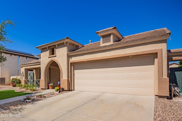 800 W Sycamore Ct, Litchfield Park, AZ 85340 - mediterranean / spanish-style house with driveway, stucco siding, and an attached garage